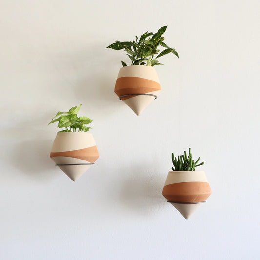 Dipped funnel clay pot set on wire stands
