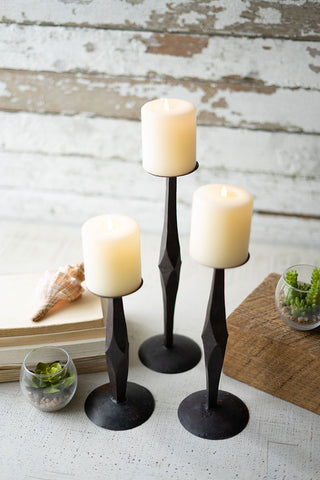 iron candle sticks with candles